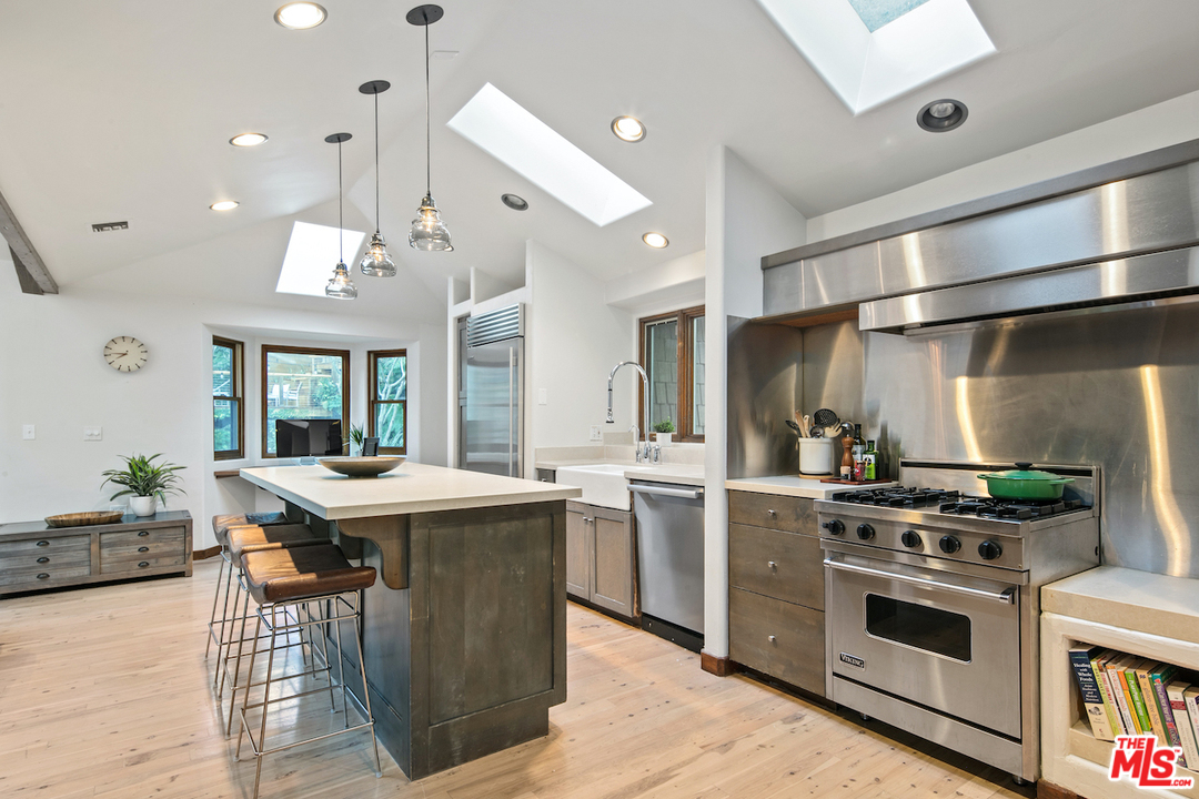 566 Stassi Lane Santa Monica, CA 90402 - Photo 14 of 26 a kitchen with stainless steel appliances a stove a sink dishwasher and a refrigerator