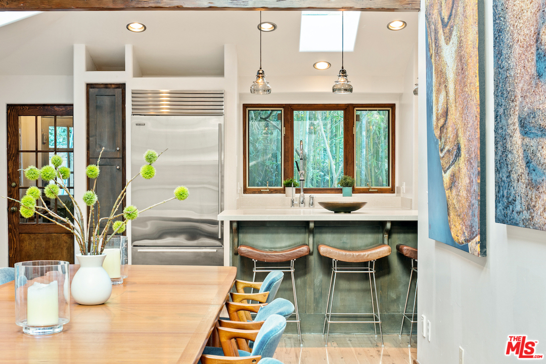 566 Stassi Lane Santa Monica, CA 90402 - Photo 15 of 26 a dining room with furniture and window
