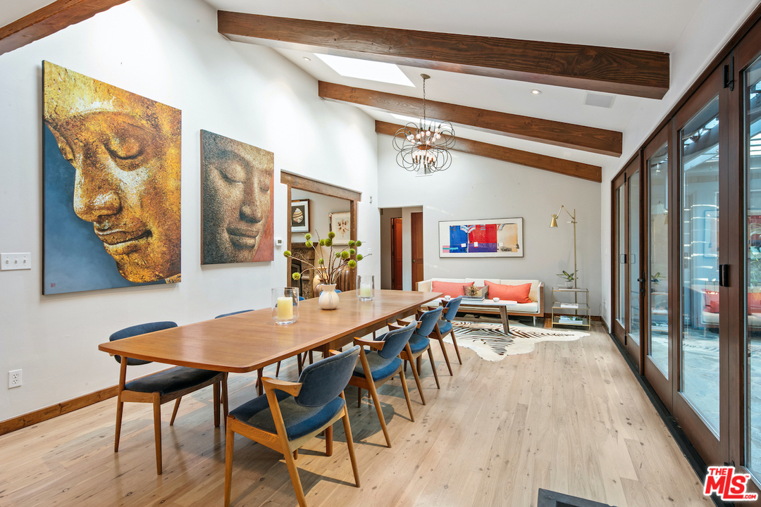 566 Stassi Lane Santa Monica, CA 90402 - Photo 16 of 26 a dining room with furniture and wooden floor