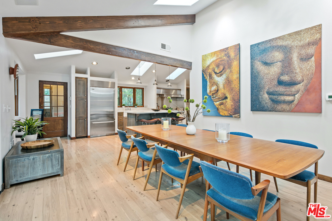 566 Stassi Lane Santa Monica, CA 90402 - Photo 17 of 26 a view of a dining room with furniture and wooden floor