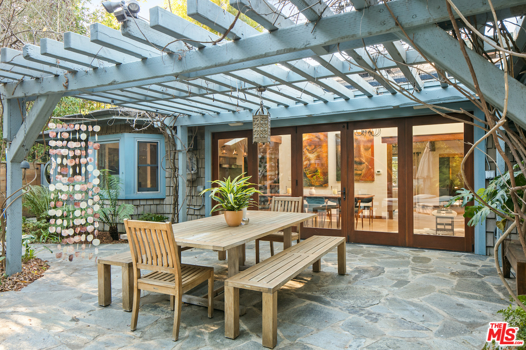 566 Stassi Lane Santa Monica, CA 90402 - Photo 21 of 26 a view of a dinning table and chairs in patio