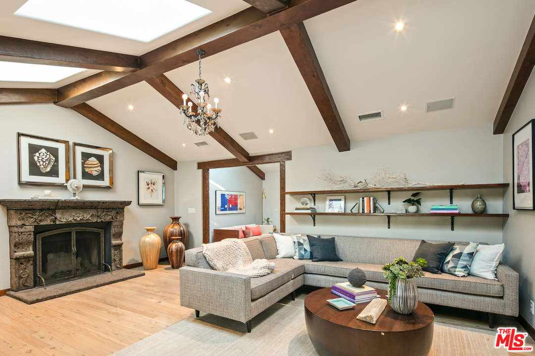 566 Stassi Lane Santa Monica, CA 90402 - Photo 6 of 26 a living room with furniture and a fireplace