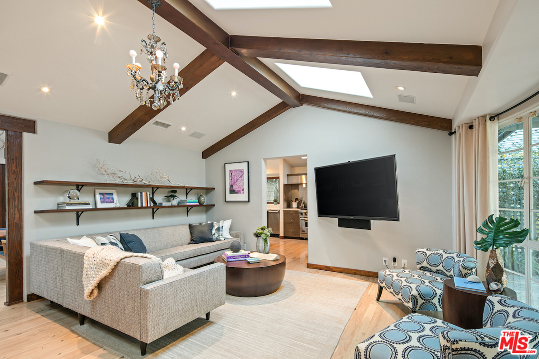 566 Stassi Lane Santa Monica, CA 90402 - Photo 7 of 26 a living room with furniture and a flat screen tv