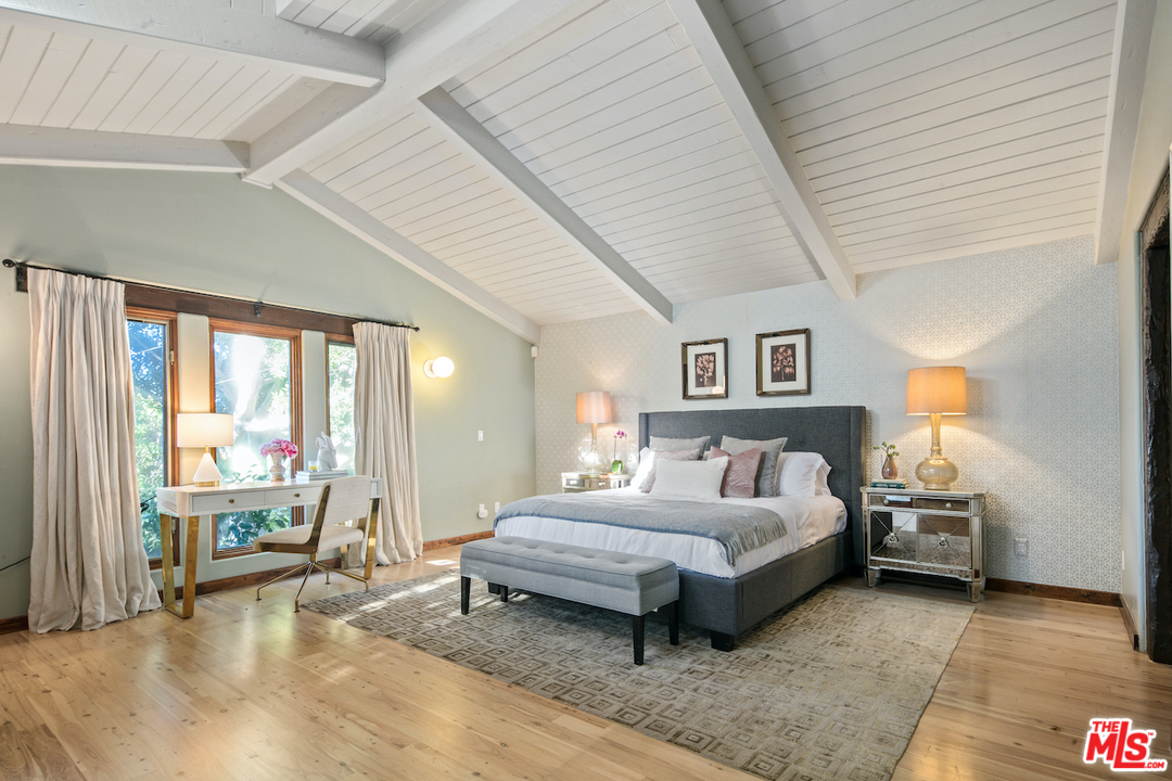 566 Stassi Lane Santa Monica, CA 90402 - Photo 8 of 26 a bedroom with furniture and a large window