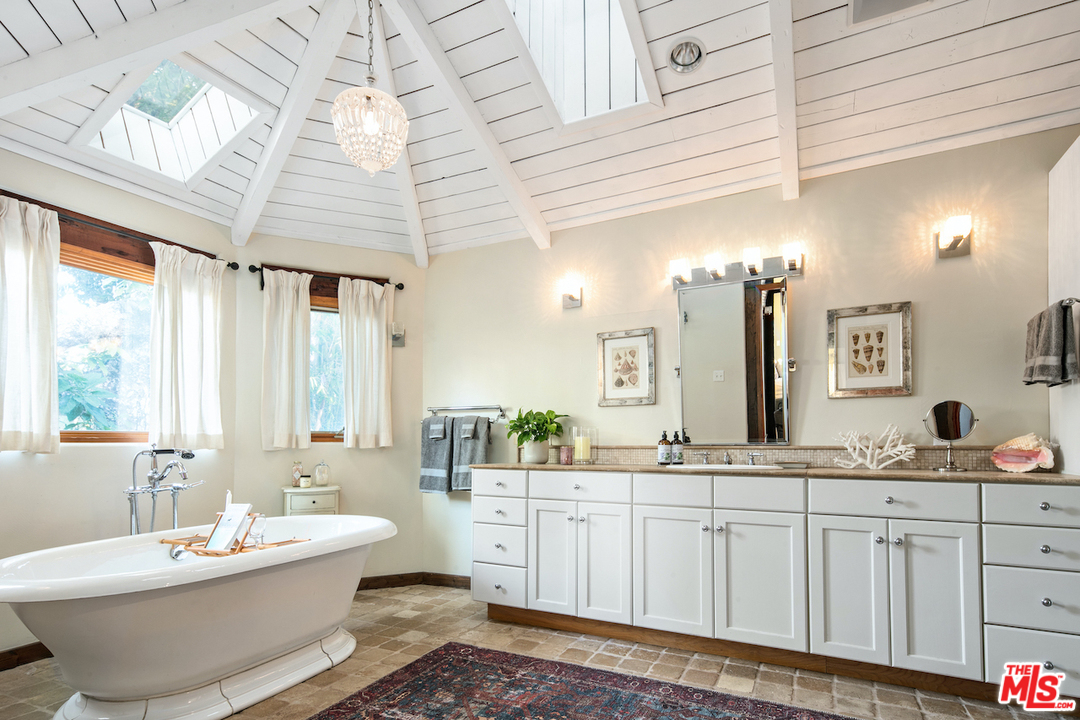 566 Stassi Lane Santa Monica, CA 90402 - Photo 10 of 26 a bathroom with a double vanity sink mirror and bathtub