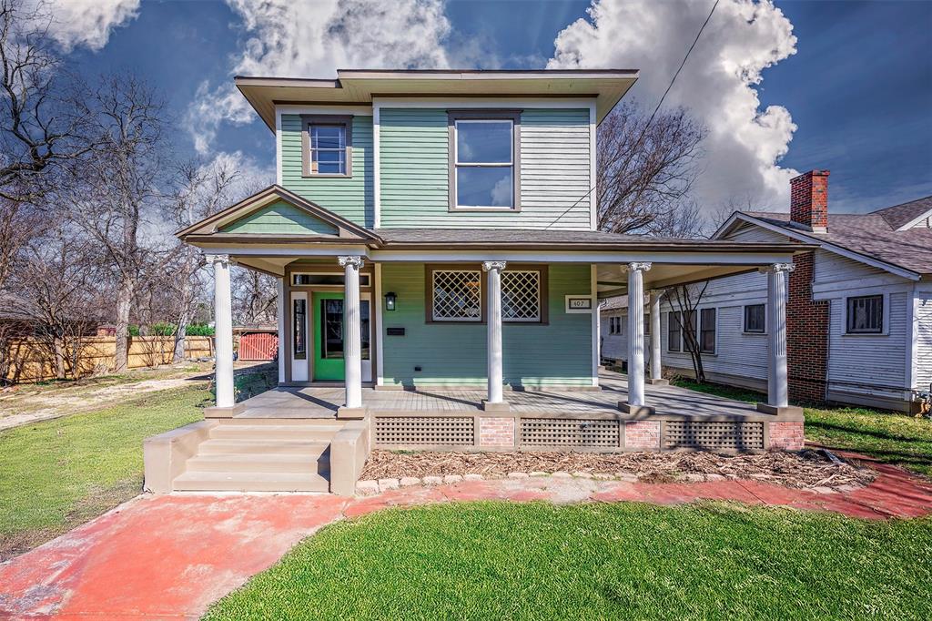 front view of a house with a yard