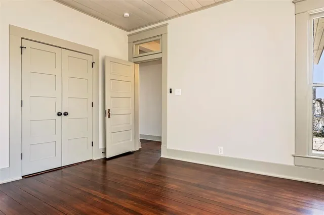 an empty room with wooden floor