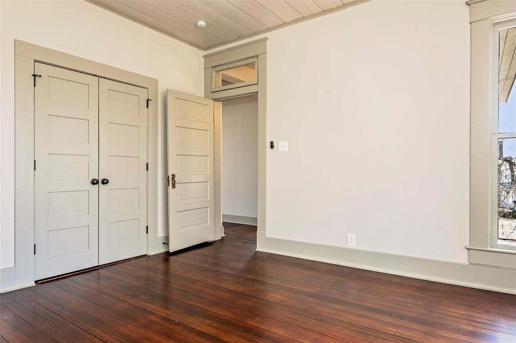 407 East Franklin Street Hillsboro, TX 76645 - Photo 12 of 16 an empty room with wooden floor