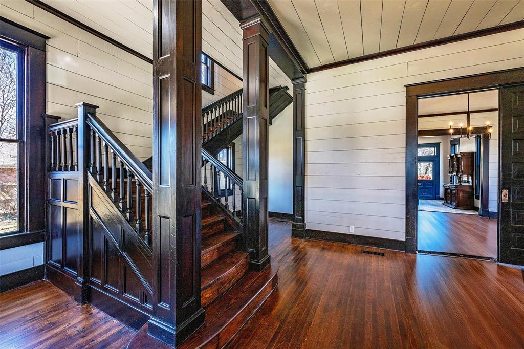 407 East Franklin Street Hillsboro, TX 76645 - Photo 4 of 16 a view of front door with wooden floor and stairs