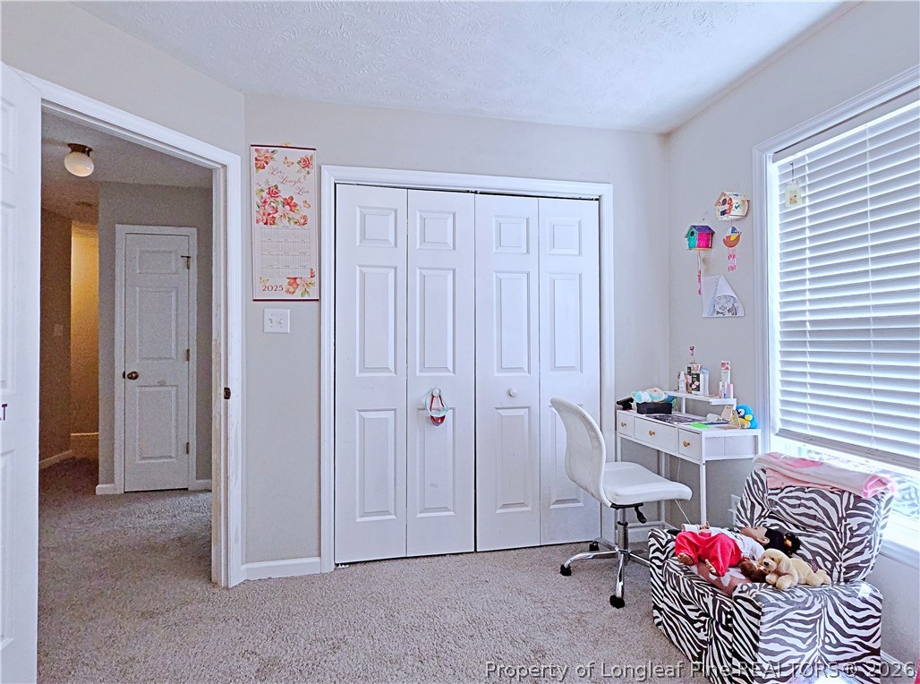 5218 Pringle Way Hope Mills, NC 28348 - Photo 28 of 43 a view of a room with workspace and lounge chair