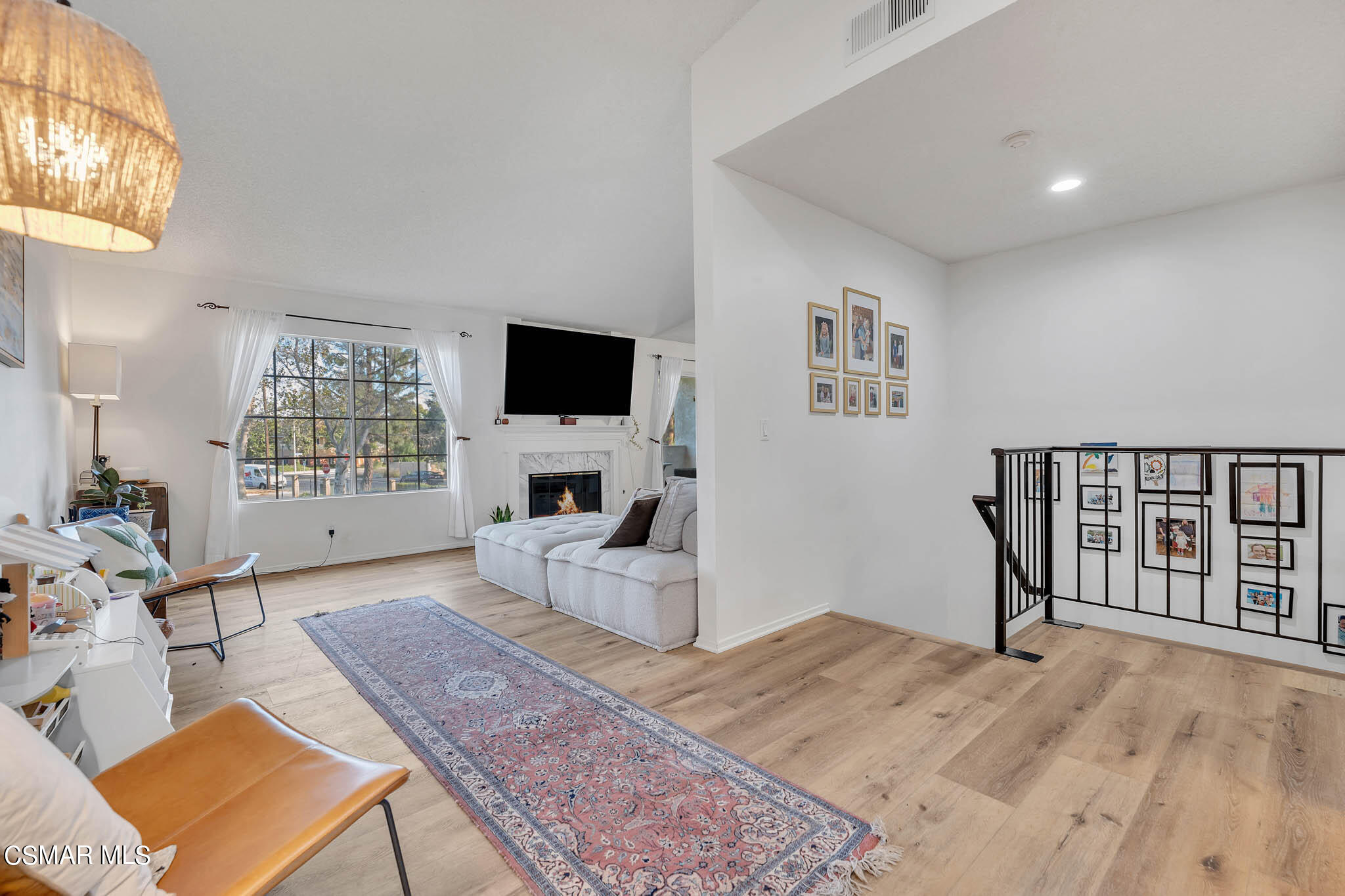 2586 Antonio Drive Camarillo, CA 93010 - Photo 12 of 37 a living room with furniture a flat screen tv and a refrigerator