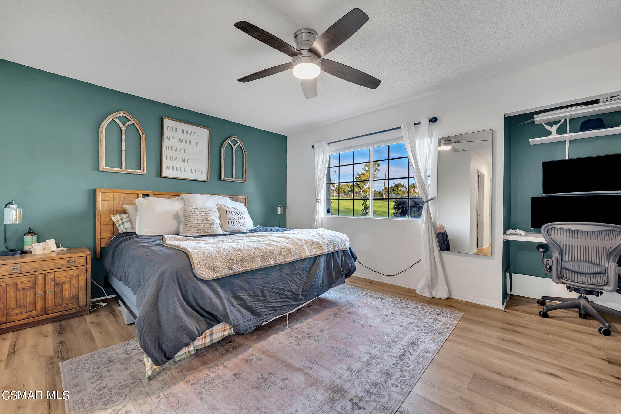 2586 Antonio Drive Camarillo, CA 93010 - Photo 14 of 37 a bedroom with a bed and a chandelier