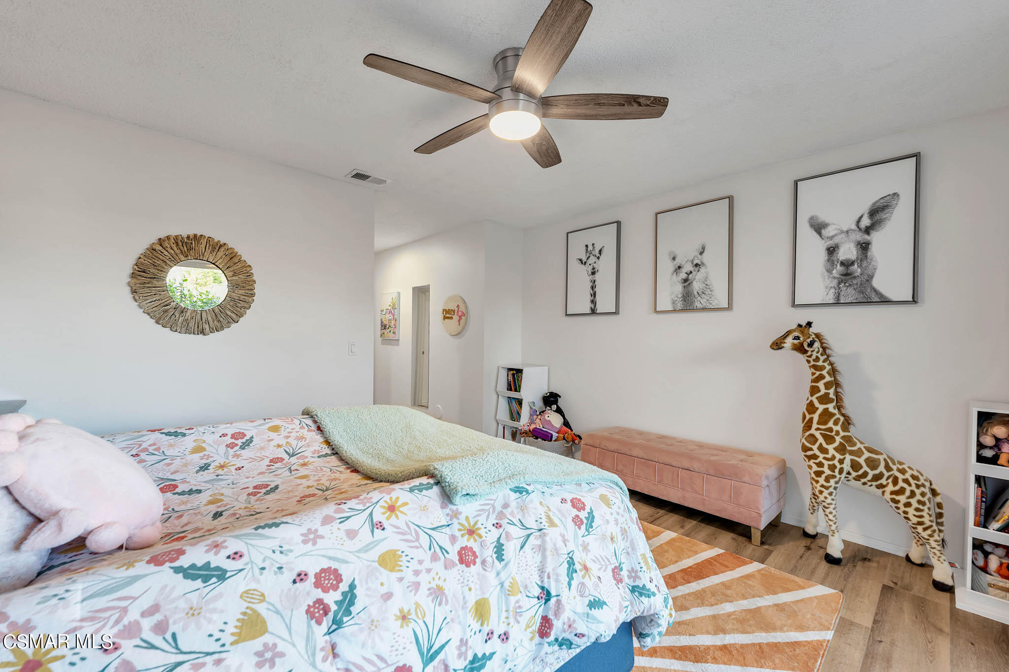 2586 Antonio Drive Camarillo, CA 93010 - Photo 22 of 37 a bedroom with a bed and a chandelier