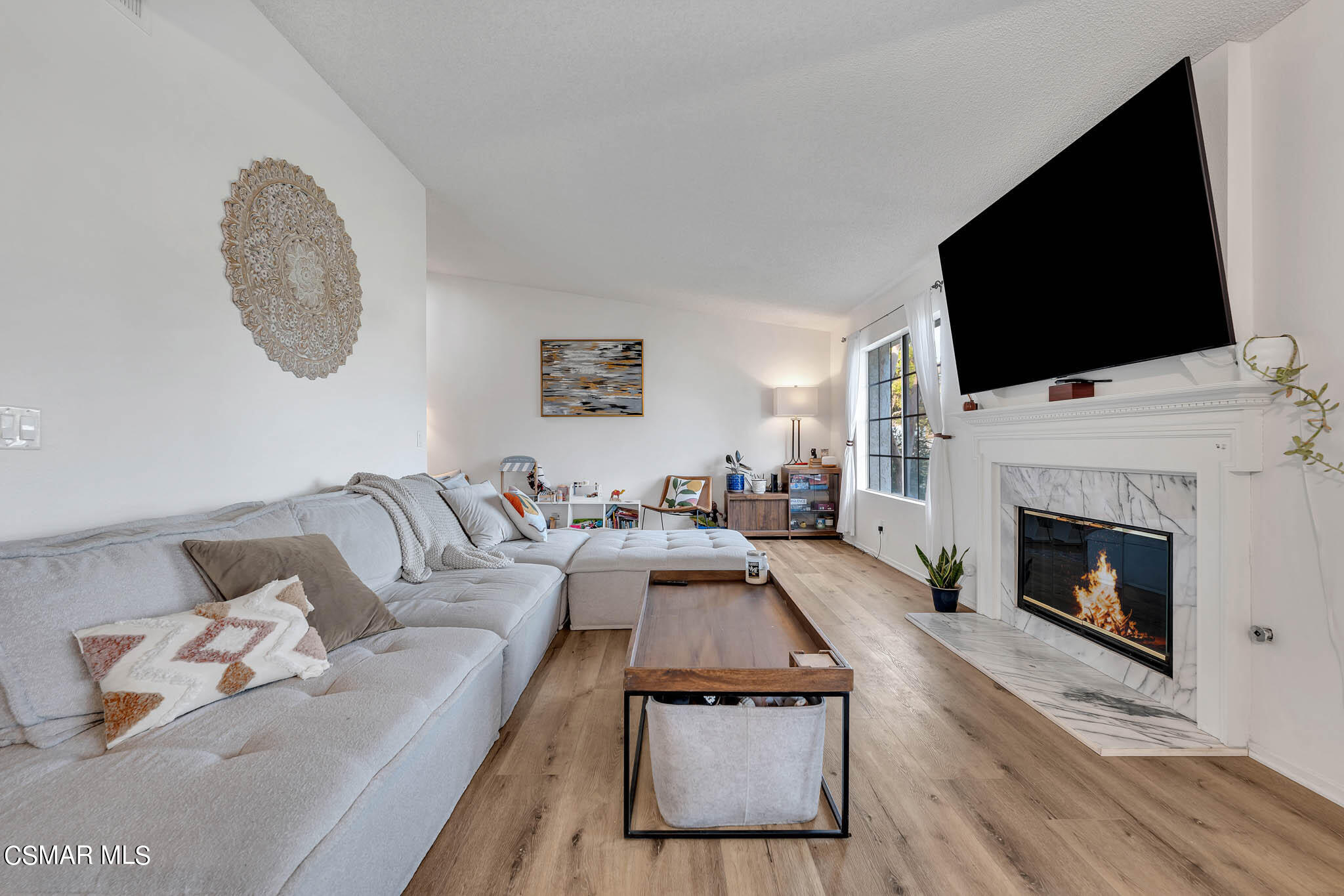 2586 Antonio Drive Camarillo, CA 93010 - Photo 4 of 37 a living room with furniture a flat screen tv and a fireplace