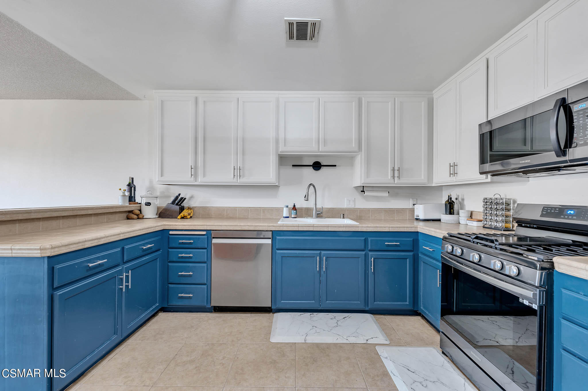 2586 Antonio Drive Camarillo, CA 93010 - Photo 5 of 37 a kitchen with stainless steel appliances granite countertop a stove microwave and cabinets