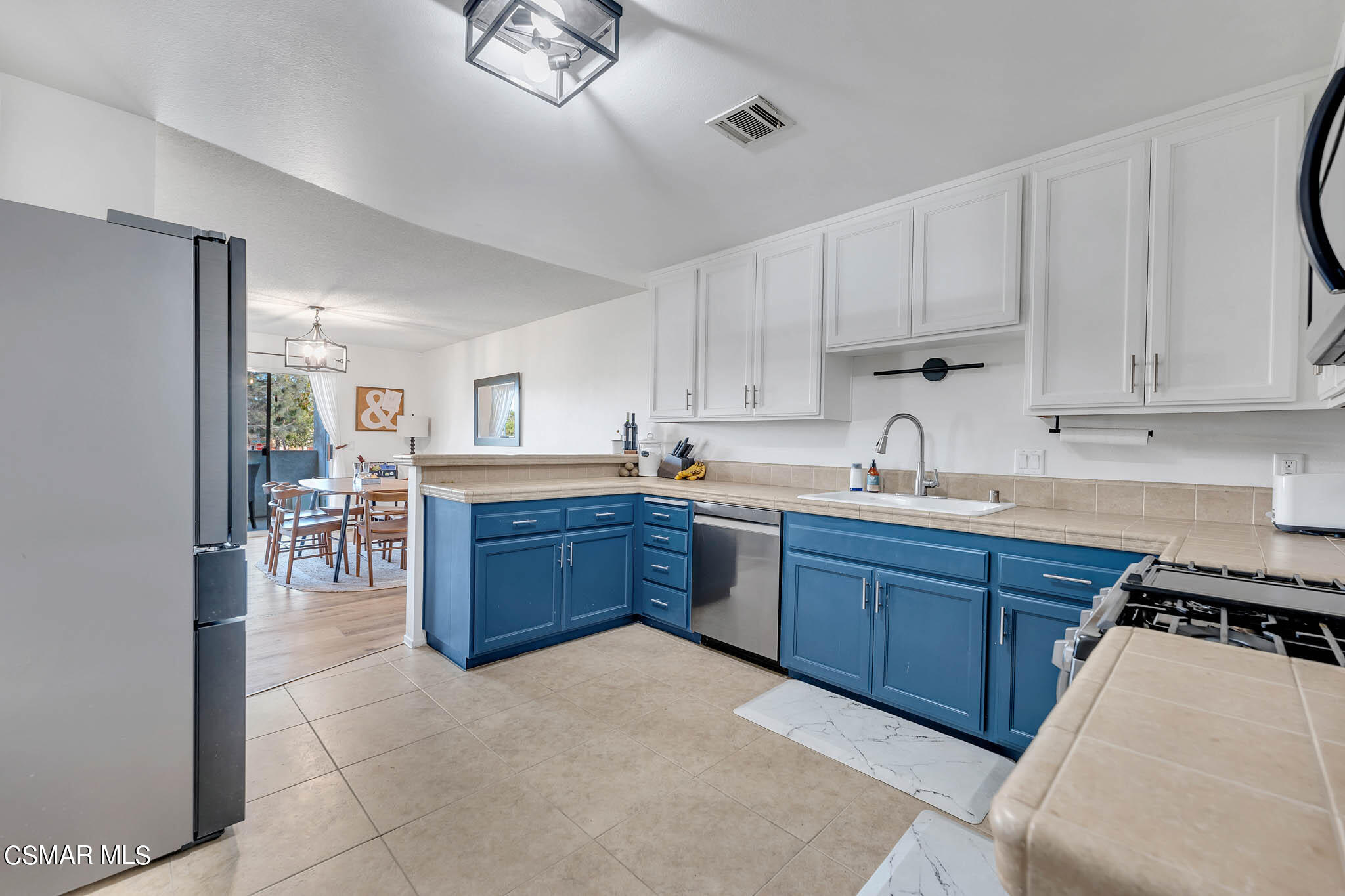 2586 Antonio Drive Camarillo, CA 93010 - Photo 7 of 37 a kitchen with stainless steel appliances granite countertop a stove refrigerator and a sink