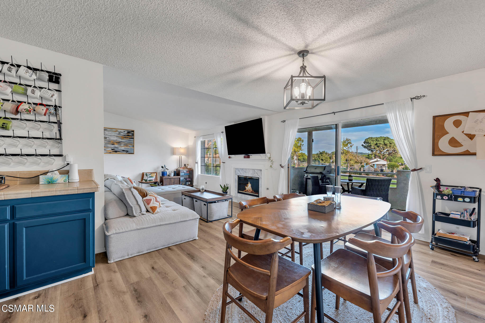 2586 Antonio Drive Camarillo, CA 93010 - Photo 9 of 37 a living room with fireplace furniture and a flat screen tv