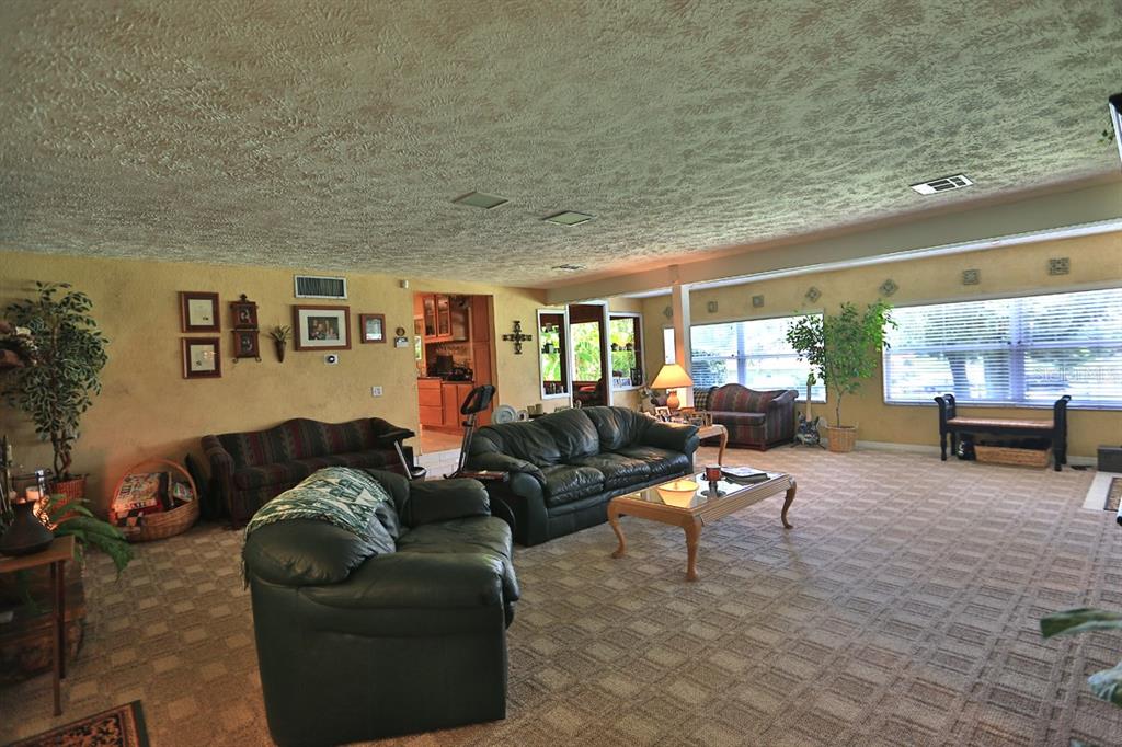 4888 Southwest 7th Avenue Road Ocala, FL 34471 - Photo 11 of 50 a living room with furniture and a window
