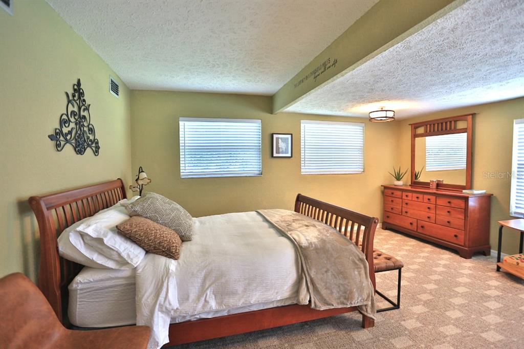 4888 Southwest 7th Avenue Road Ocala, FL 34471 - Photo 26 of 50 a bedroom with a bed and wooden floor