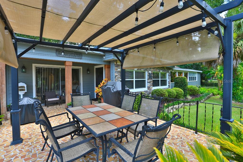 4888 Southwest 7th Avenue Road Ocala, FL 34471 - Photo 29 of 50 a view of a patio with a table and chairs