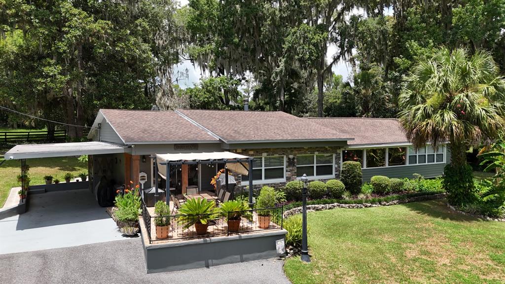 4888 Southwest 7th Avenue Road Ocala, FL 34471 - Photo 50 of 50 a front view of a house with garden