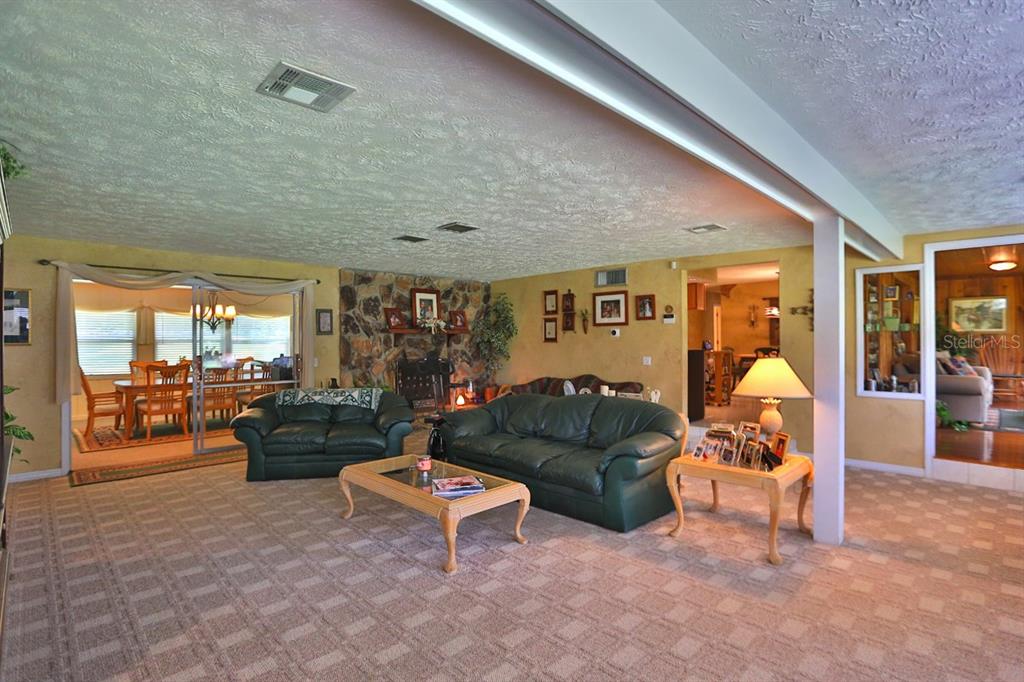 4888 Southwest 7th Avenue Road Ocala, FL 34471 - Photo 8 of 50 a living room with furniture and a table