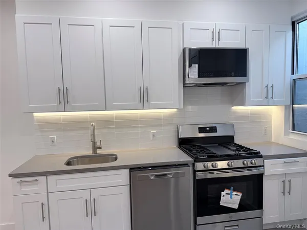 a view of hallway with wooden floor