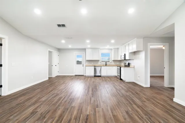 a view of kitchen with wooden floor