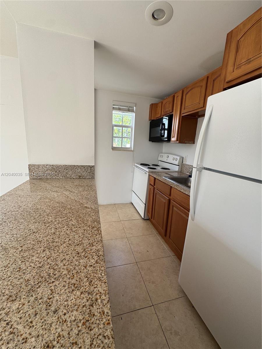 7130 Rue Versailles Drive, Unit 11 Miami Beach, FL 33141 - Photo 7 of 16