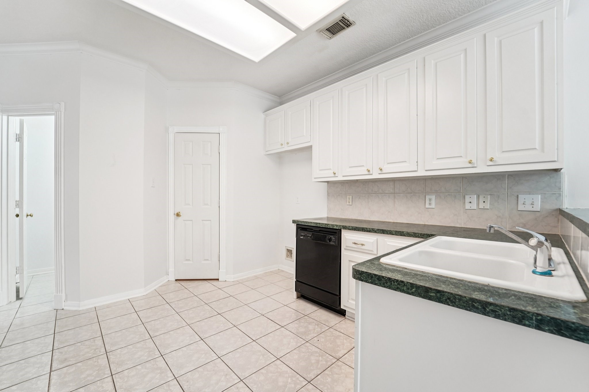 14420 Walters Road, Unit 55 Houston, TX 77014 - Photo 15 of 35 It has tiled flooring and a single-basin sink, providing a clean and functional space.