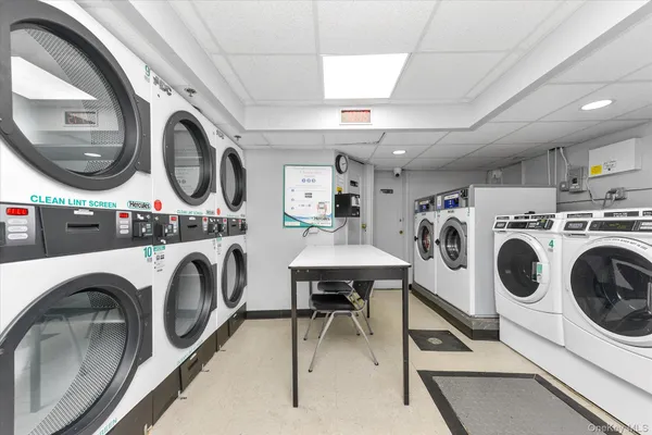 a view of livingroom with washer and dryer