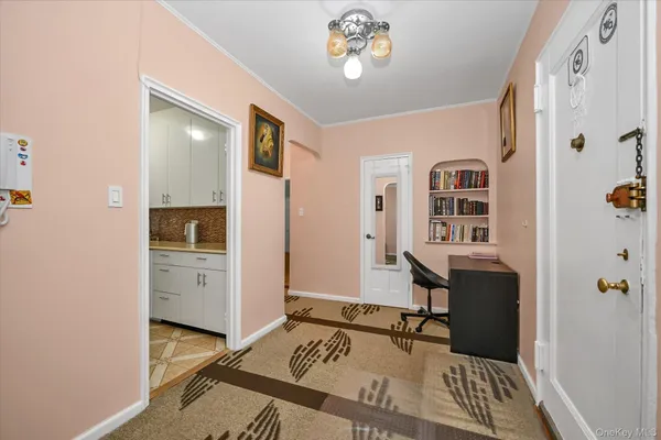 a bedroom with furniture and a window