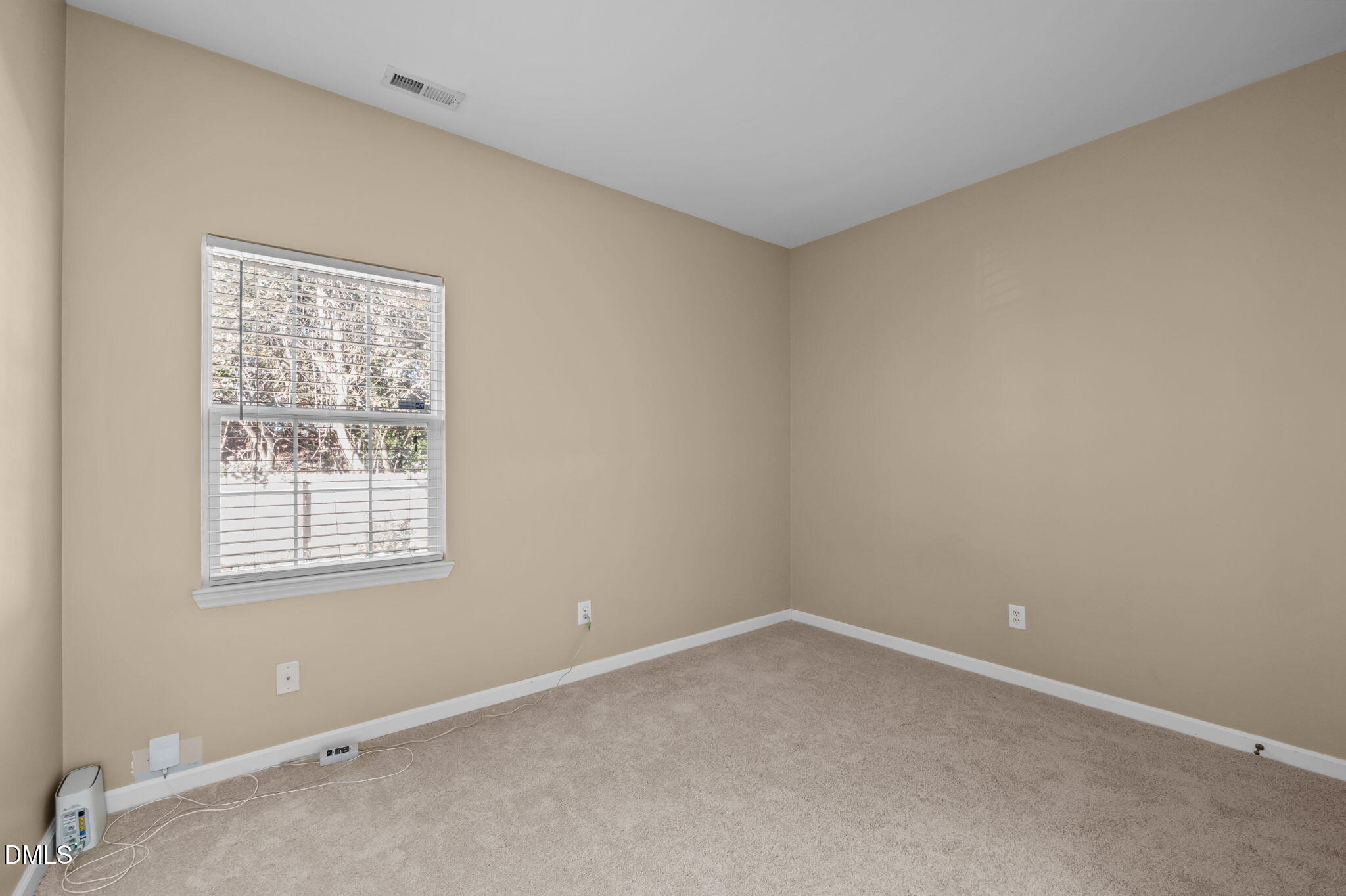 4211 Holston Drive Durham, NC 27704 - Photo 12 of 33 wooden floor and window in an empty room