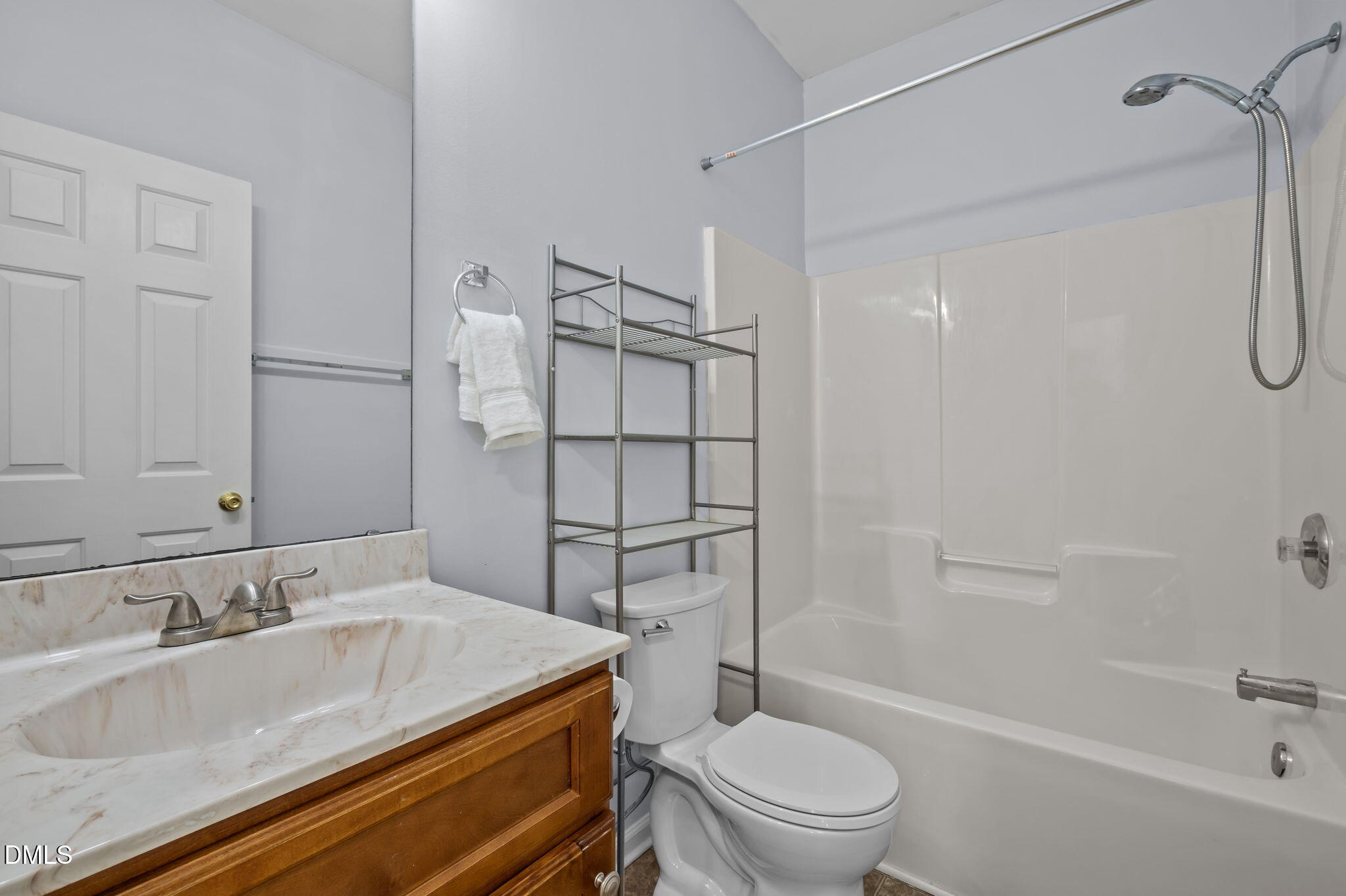 4211 Holston Drive Durham, NC 27704 - Photo 14 of 33 a bathroom with a granite countertop sink toilet and shower