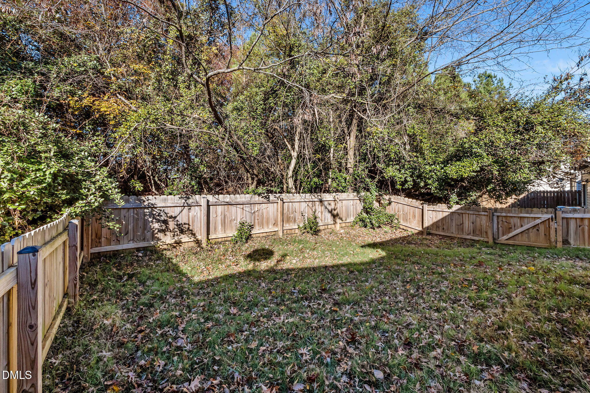 4211 Holston Drive Durham, NC 27704 - Photo 23 of 33 a view of a backyard with wooden fence