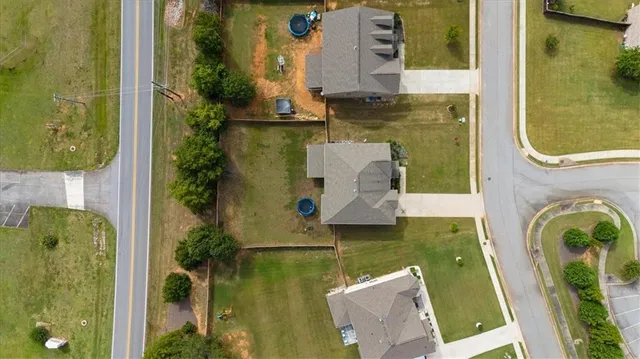 an aerial view of a house with swimming pool