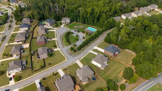 an aerial view of a house with outdoor space