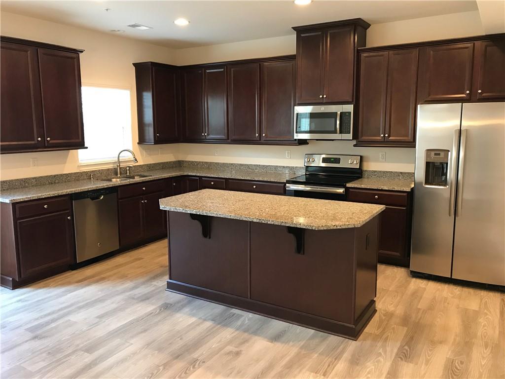 2004 Pointe View Drive Mars, PA 16046 - Photo 4 of 23 a kitchen with stainless steel appliances granite countertop a stove a sink dishwasher a refrigerator and a microwave oven