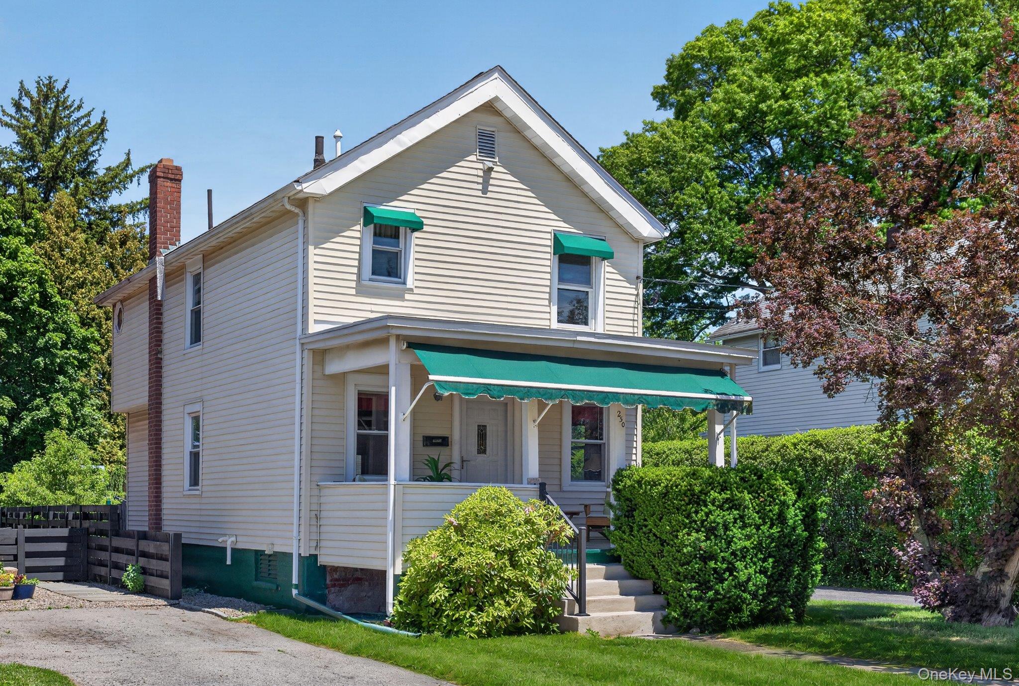 250 Rombout Avenue Beacon, NY 12508 - Photo 1 of 33 a front view of a house with a yard and potted plants