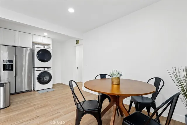 an empty room with a ceiling fan and window