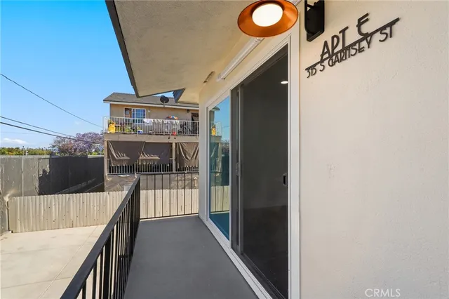 a aerial view of a house with wooden fence