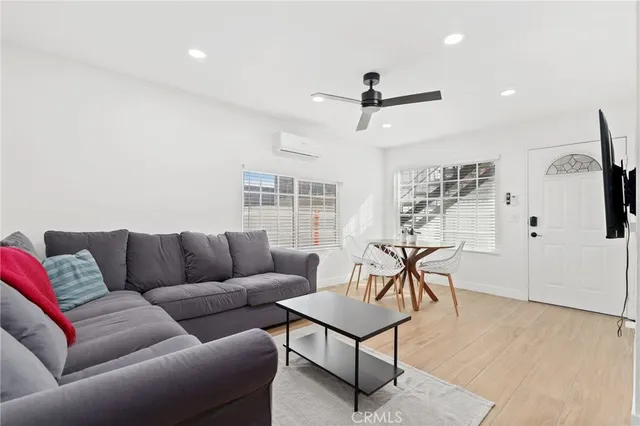 a view of a kitchen with a sink and a refrigerator