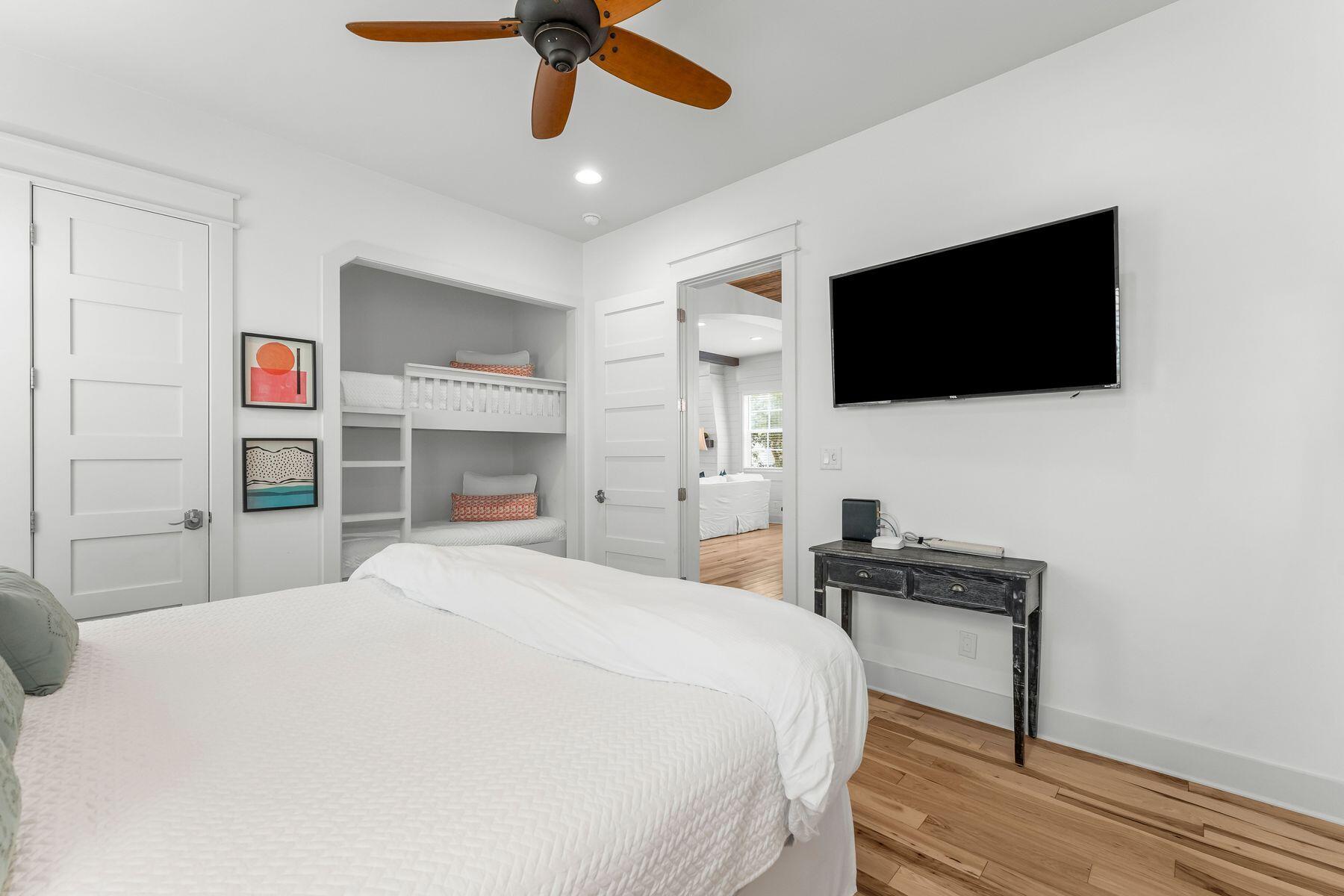 44 The Greenway Loop Inlet Beach, FL 32461 - Photo 17 of 61 a bedroom with a bed and a flat screen tv