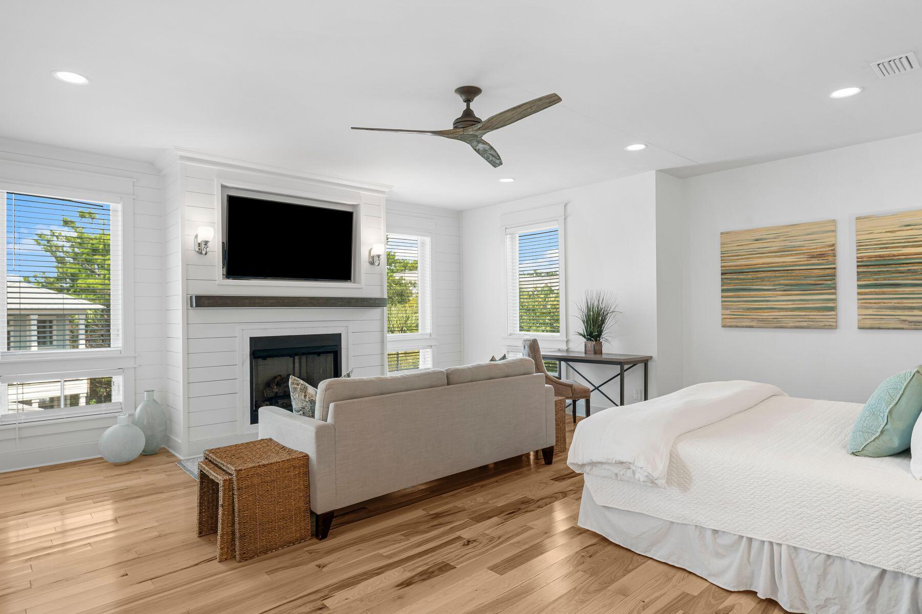 44 The Greenway Loop Inlet Beach, FL 32461 - Photo 20 of 61 a living room with furniture a fireplace and a flat screen tv