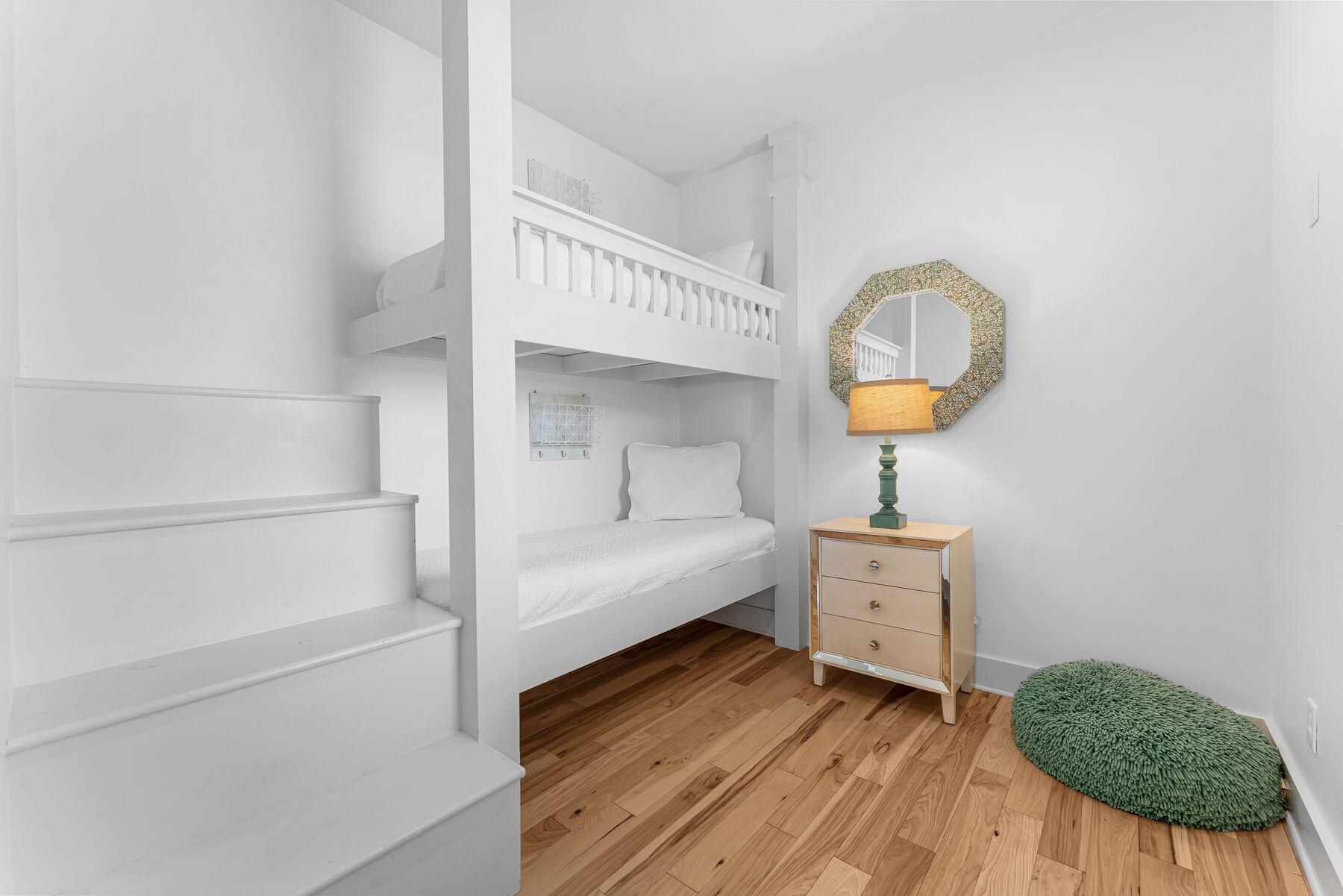 44 The Greenway Loop Inlet Beach, FL 32461 - Photo 23 of 61 a view of bedroom and hall with wooden floor