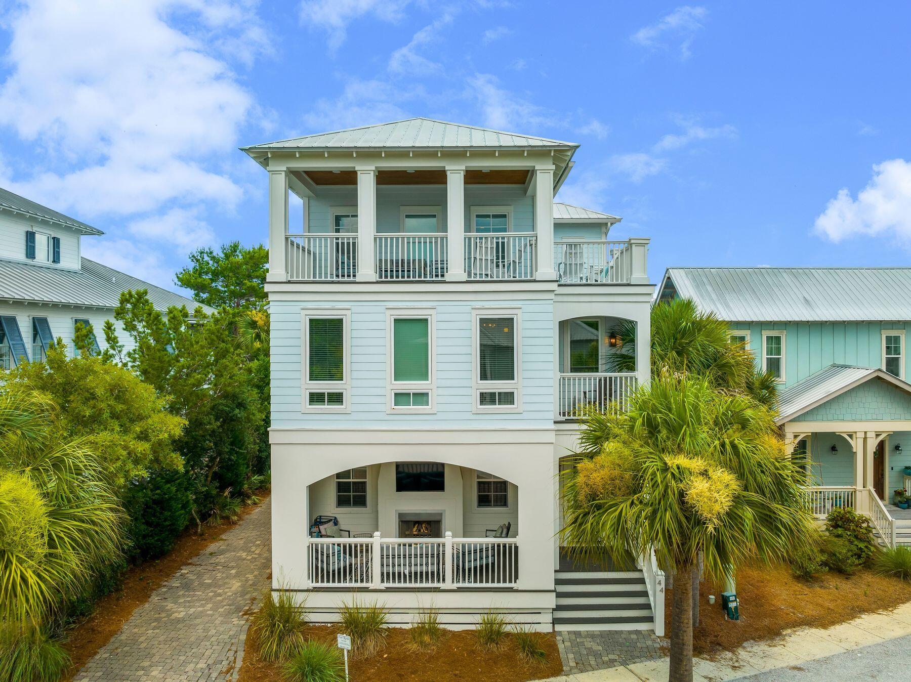44 The Greenway Loop Inlet Beach, FL 32461 - Photo 3 of 61 a front view of a house with a yard