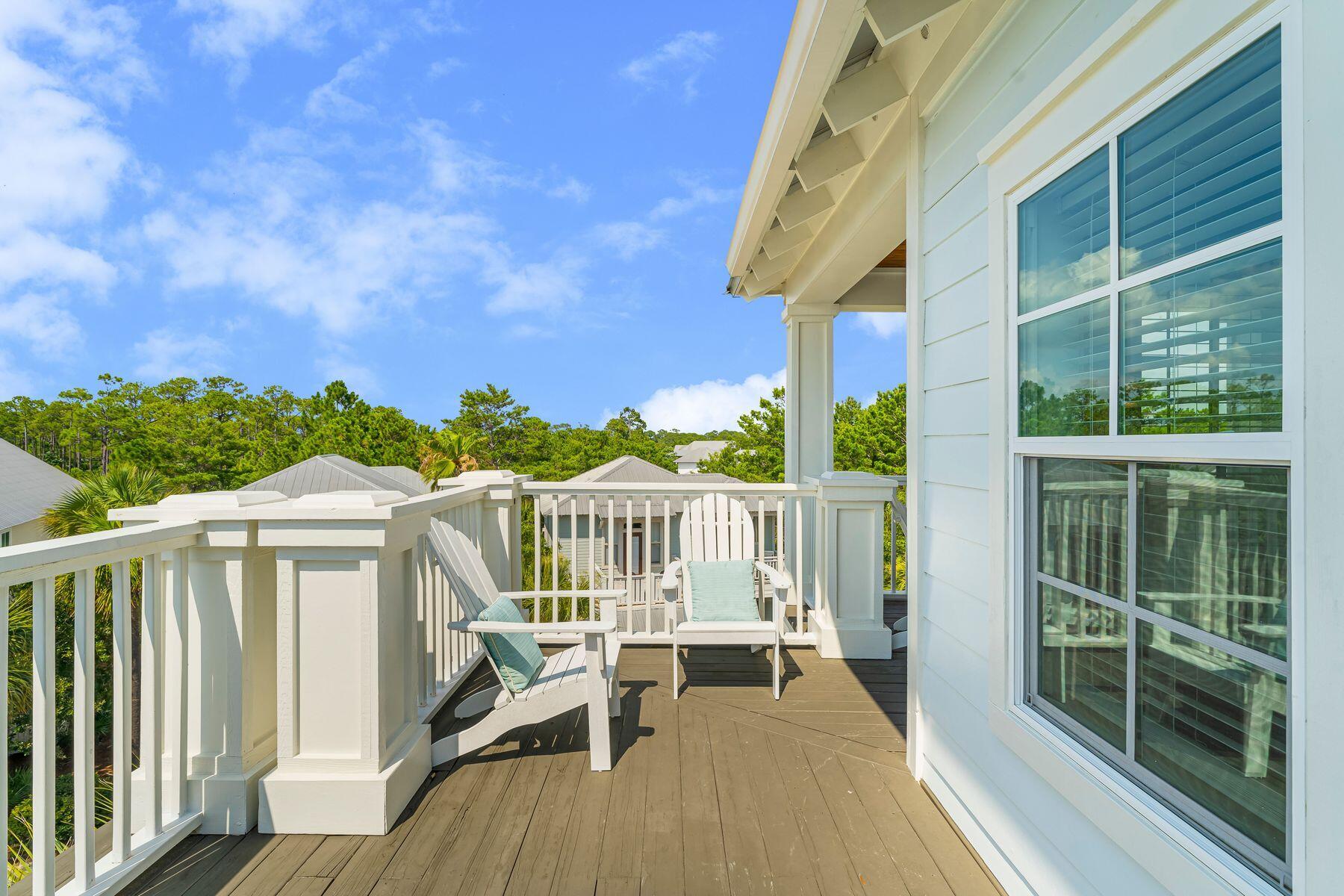 44 The Greenway Loop Inlet Beach, FL 32461 - Photo 47 of 61 a view of a chair and table in the balcony