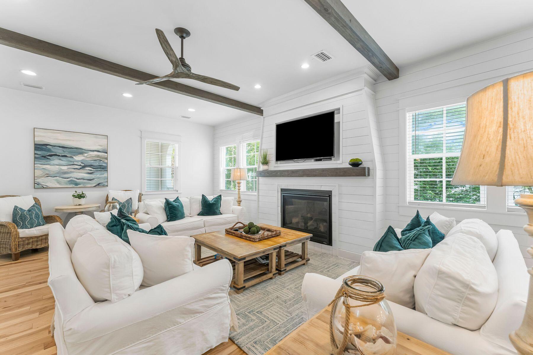 44 The Greenway Loop Inlet Beach, FL 32461 - Photo 9 of 61 a living room with furniture fireplace and a large window