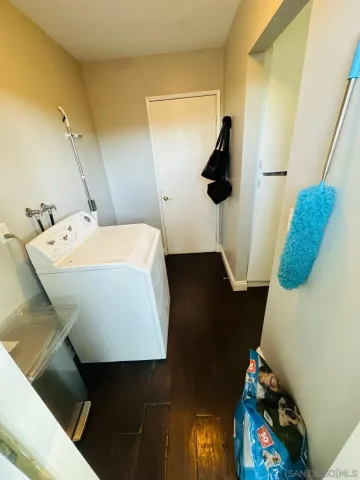 a bedroom with a bed and a mirror