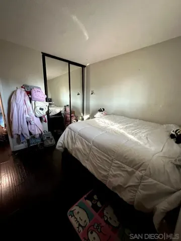 a kitchen with stainless steel appliances a sink a stove a refrigerator a sink a window and cabinets